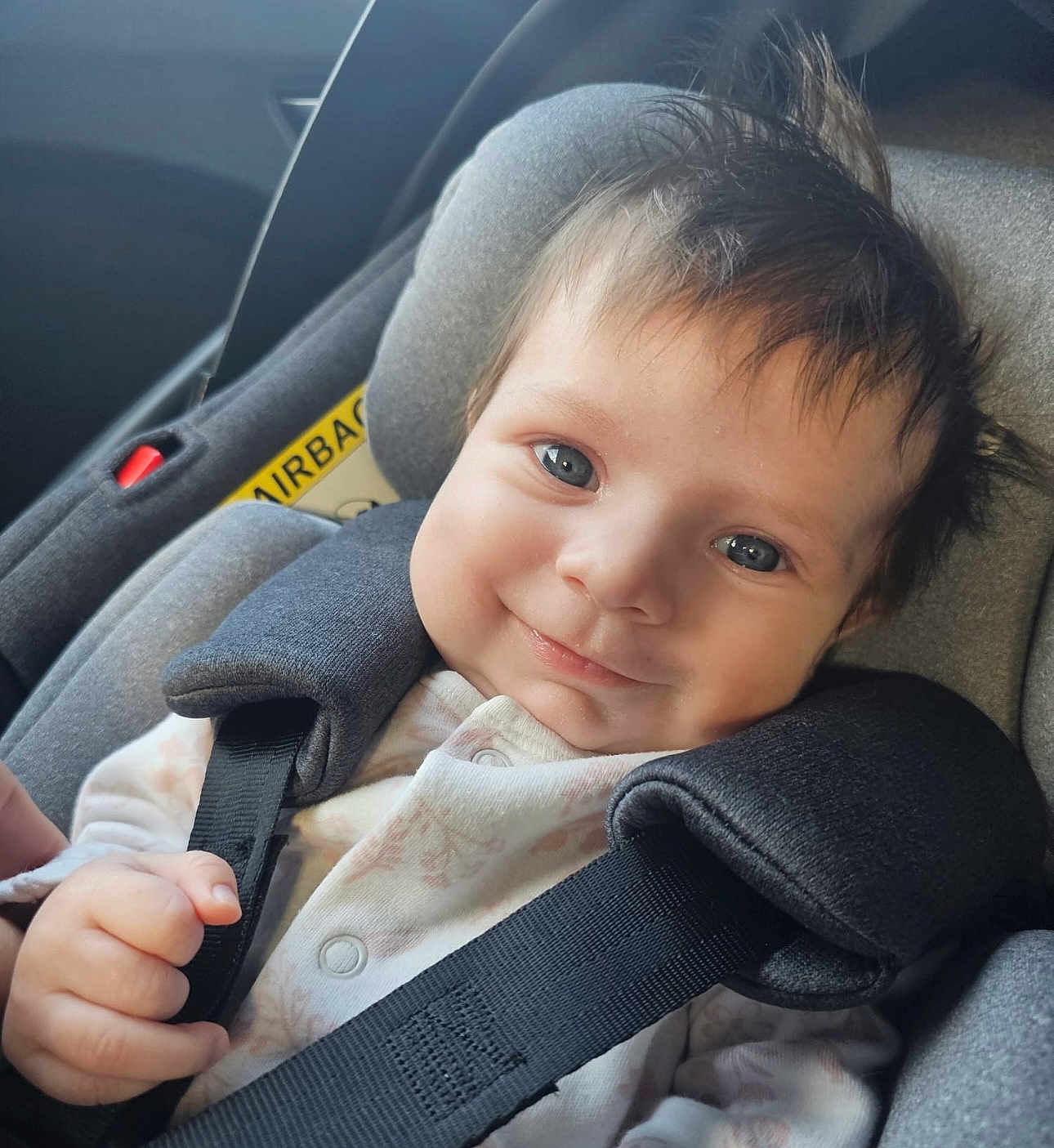 Lyla joined the competition — help win amazing prizes! baby, car_seat, child, smiling, blue_eyes, hair, seatbelt, clothing, infant, face, hand, straps, happy, portrait, car_interior, safety, cute, young_child, seat, closeup