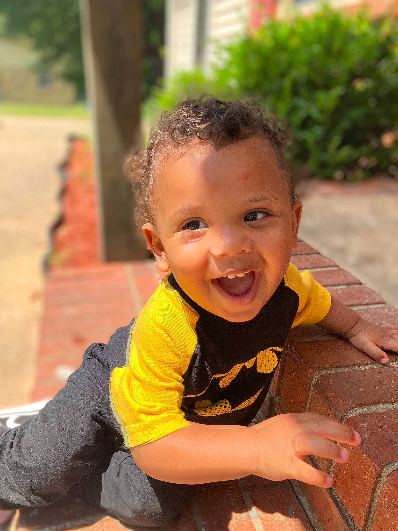 Brandon Jr is registered to the contest to win money with this photo: baby, baby_toddler_clothing, child, eye, finger, flooring, fun, grass, happy, joy, leisure, orange, people_in_nature, person, plant, recreation, sitting, skin, smile, toddler