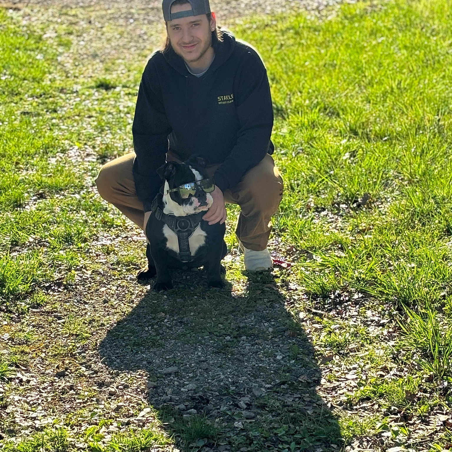 Diva joined the competition — help win amazing prizes! asphalt, cap, garden, grass, grass_family, grassland, groundcover, hat, landscape, landscaping, lawn, people_in_nature, personal_protective_equipment, plant, road_surface, shadow, shrub, sitting, smile, soil