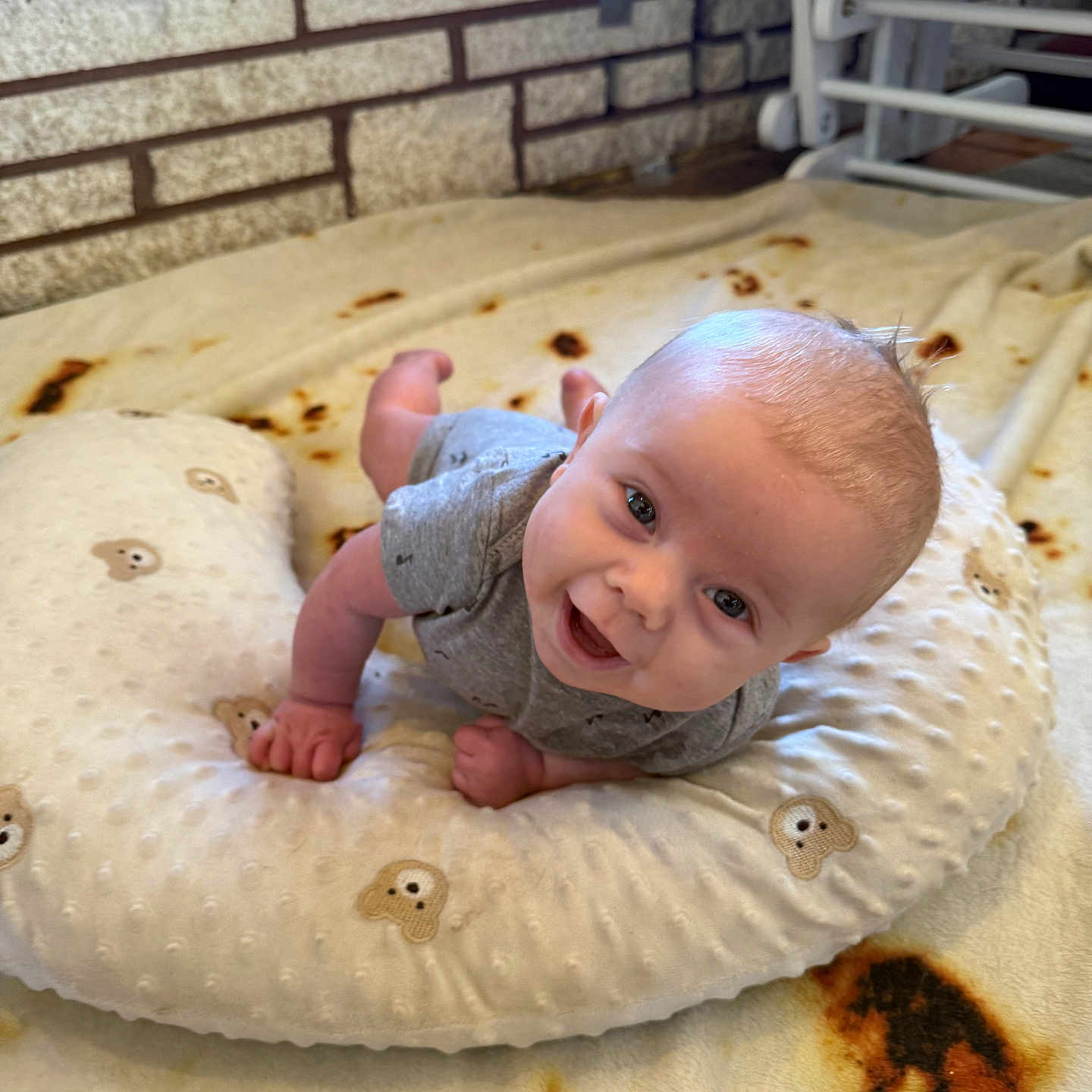 Weston is registered to the contest to win money with this photo: baby, bodypart, bread, clothing, cushion, face, finger, food, furniture, hand, happy, head, homedecor, newborn, pants, person, photography, pillow, portrait, smile