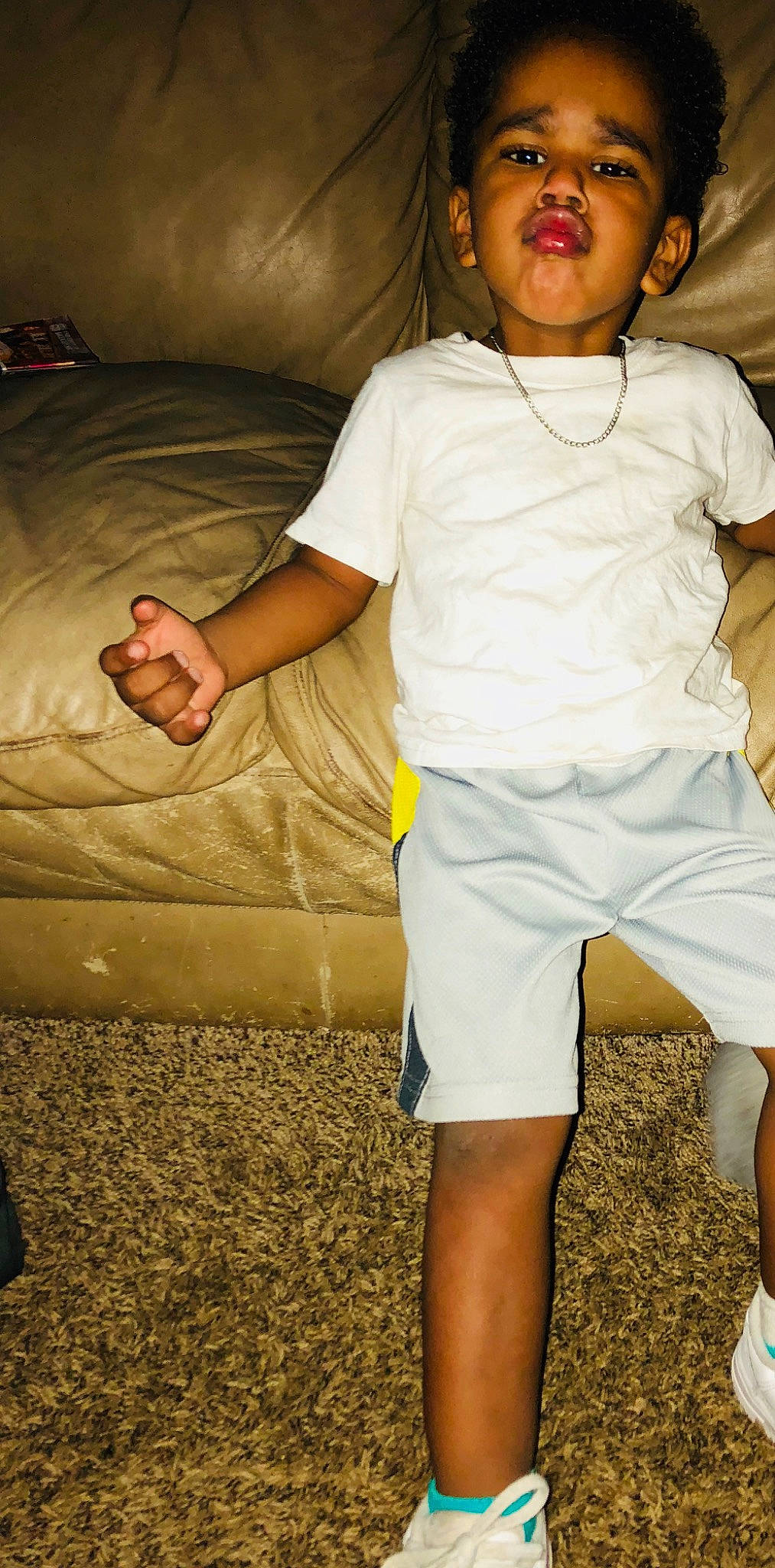 Jaziah is registered to the contest to win money with this photo: arm, baby, child, fun, leg, person, play, shoe, shorts, sitting, smile, t_shirt, toddler, trunk, vacation, white