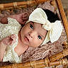 Aurora joined the competition — help win amazing prizes! baby, infant, headband, bow, lace_clothing, wicker_basket, blanket, soft_texture, cute, portrait, newborn, resting, hand, face, eyes, indoor, closeup, child, adorable, peaceful