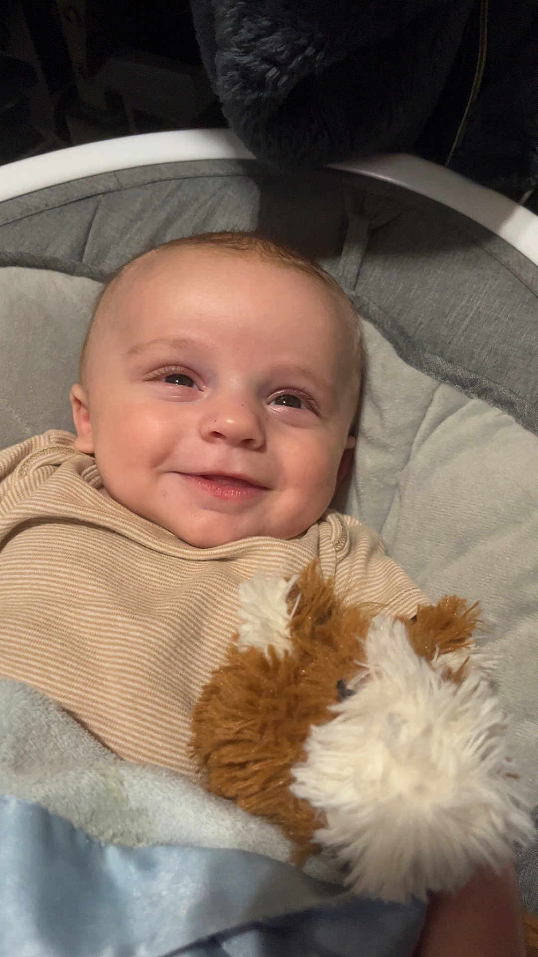 Dallas is registered to the contest to win money with this photo: baby, smiling, infant, stuffed_animal, toy, blanket, cozy, face, child, clothing, seat, comfort, cute, happy, portrait, indoors, soft_lighting, closeup, warm, snuggle