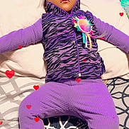Angelia is registered to the contest to win money with this photo: child, sleeping, purple_clothing, boots, bed, pillow, patterned_bedding, heart_graphics, indoor, cozy, zebra_print, vest, toddler, resting, cute, warm_clothing, fuzzy_boots, blanket, peaceful, infant