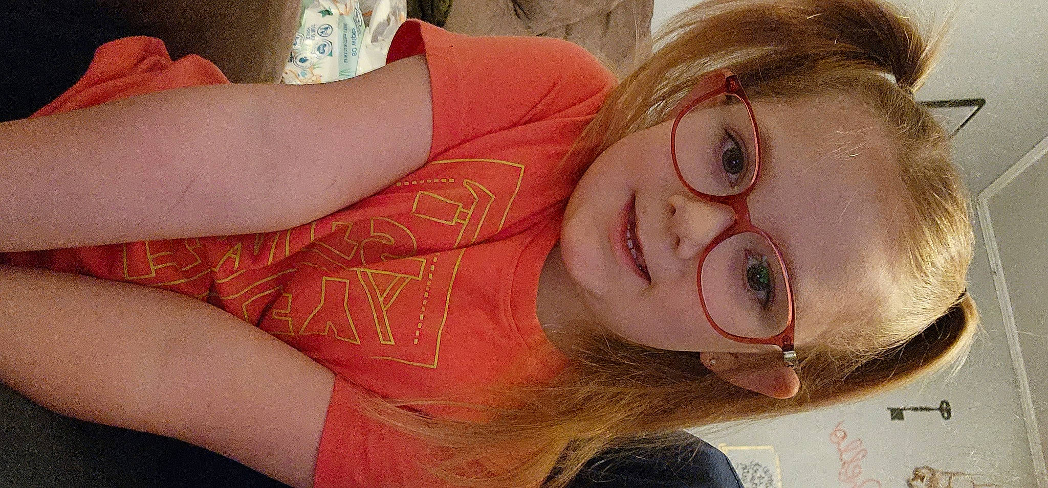 Arabella is registered to the contest to win money with this photo: arm, cheek, ear, eyebrow, eyelash, eyewear, facial_expression, finger, forehead, glasses, hair, happy, jaw, lip, mouth, neck, nose, person, skin, smile