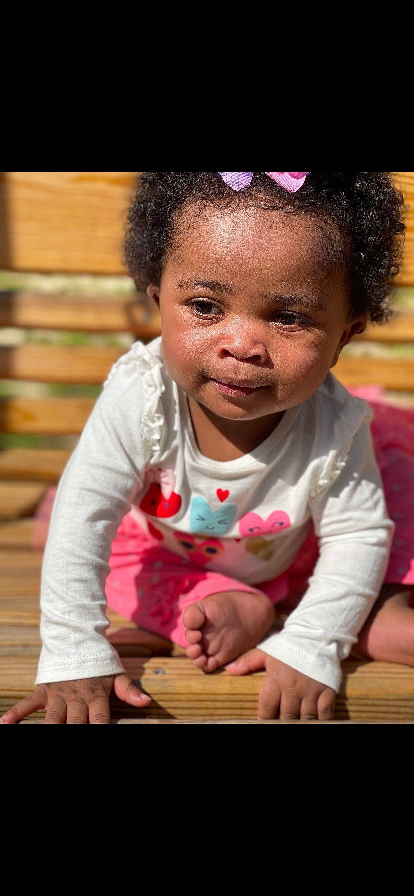 Emerald is registered to the contest to win money with this photo: baby, baby_toddler_clothing, cheek, eye, face, flash_photography, grass, hair, happy, head, human_body, iris, lip, mouth, nose, person, pink, skin, smile, toddler