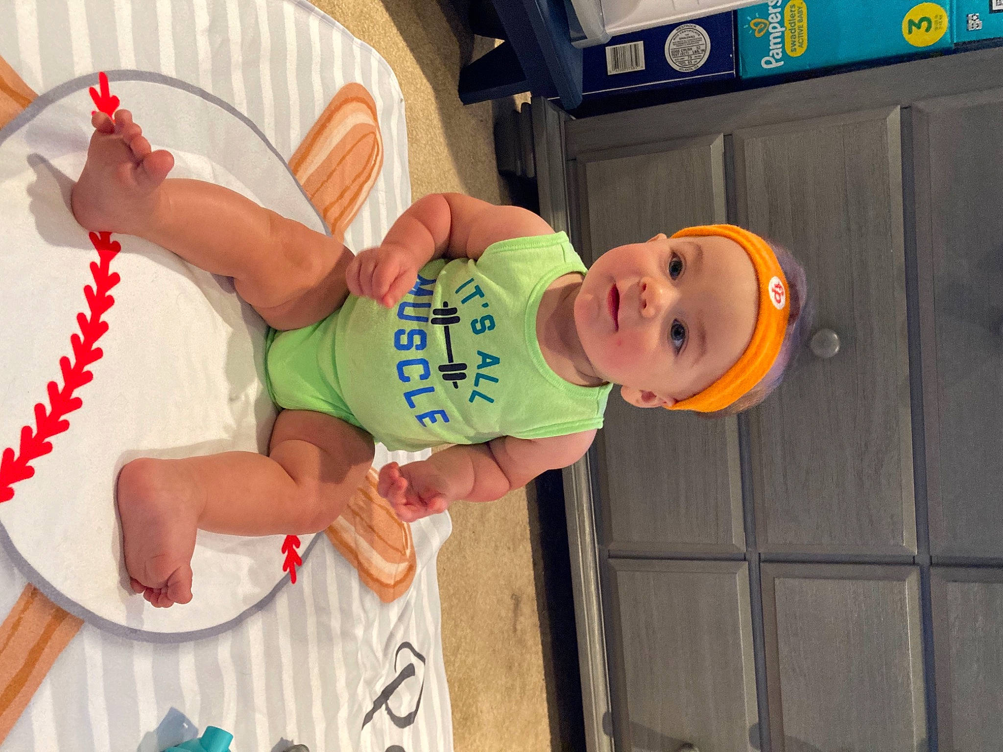 Paul joined the competition — help win amazing prizes! baby, baby_toddler_clothing, chair, child, facial_expression, fun, happy, hat, headgear, leisure, mouth, orange, party, person, play, room, smile, t_shirt, thigh, toddler