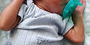 K'Rson joined the competition — help win amazing prizes! baby, newborn, sleeping, pacifier, onesie, blue_clothing, infant, hand, face, ear, blanket, pattern, peaceful, resting, cute, skin, closeup, portrait, child, indoor
