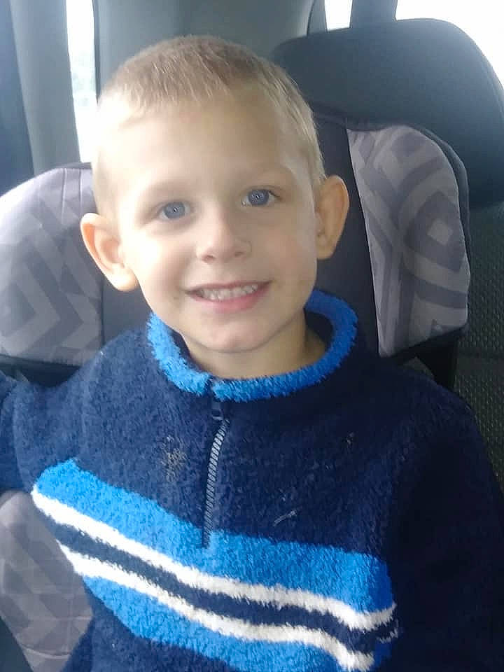 Jayden is registered to the contest to win money with this photo: baby, cheek, child, cool, electronic_device, eye, face, forehead, hair, hairstyle, head, joy, male, nose, outerwear, people, person, sitting, skin, smile