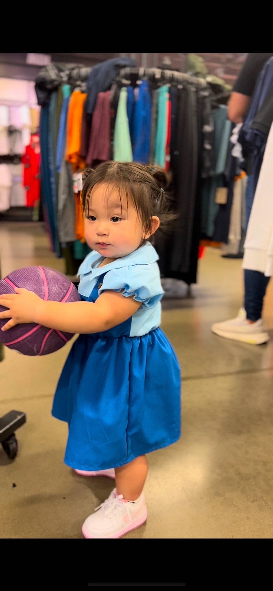 Amira is registered to the contest to win money with this photo: ball, blue, child, electric_blue, event, fashion_design, flooring, fun, happy, joint, leisure, person, recreation, room, sandal, shoe, shopping, skin, sneakers, standing