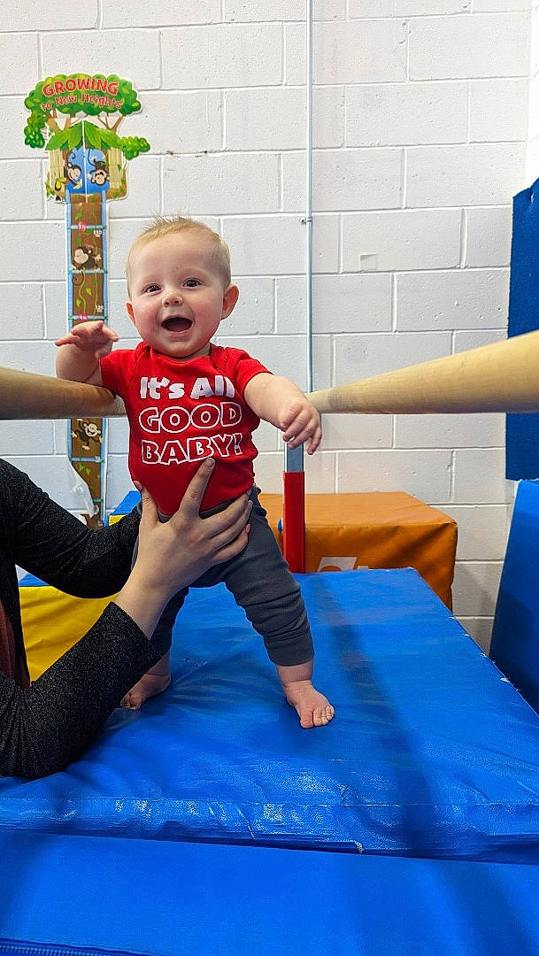 Maverick joined the competition — help win amazing prizes! baby, baby_toddler_clothing, barefoot, blue, child, elbow, electric_blue, flooring, fun, happy, human_leg, knee, leisure, person, recreation, sitting, sleeve, smile, sportswear, t_shirt