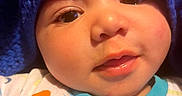 Monté joined the competition — help win amazing prizes! baby, blanket, blue, child, close_up, clothing, colorful, cute, expression, eyes, face, infant, knitted, mouth, pattern, portrait, skin, soft_lighting, warmth, zipper