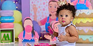 Aubree joined the competition — help win amazing prizes! background, balloons, birthday, cake, celebration, child, colorful, crown, curly_hair, cute, decorations, festive, floor, frosting, indoors, party, pink, smile, toddler, white_clothing