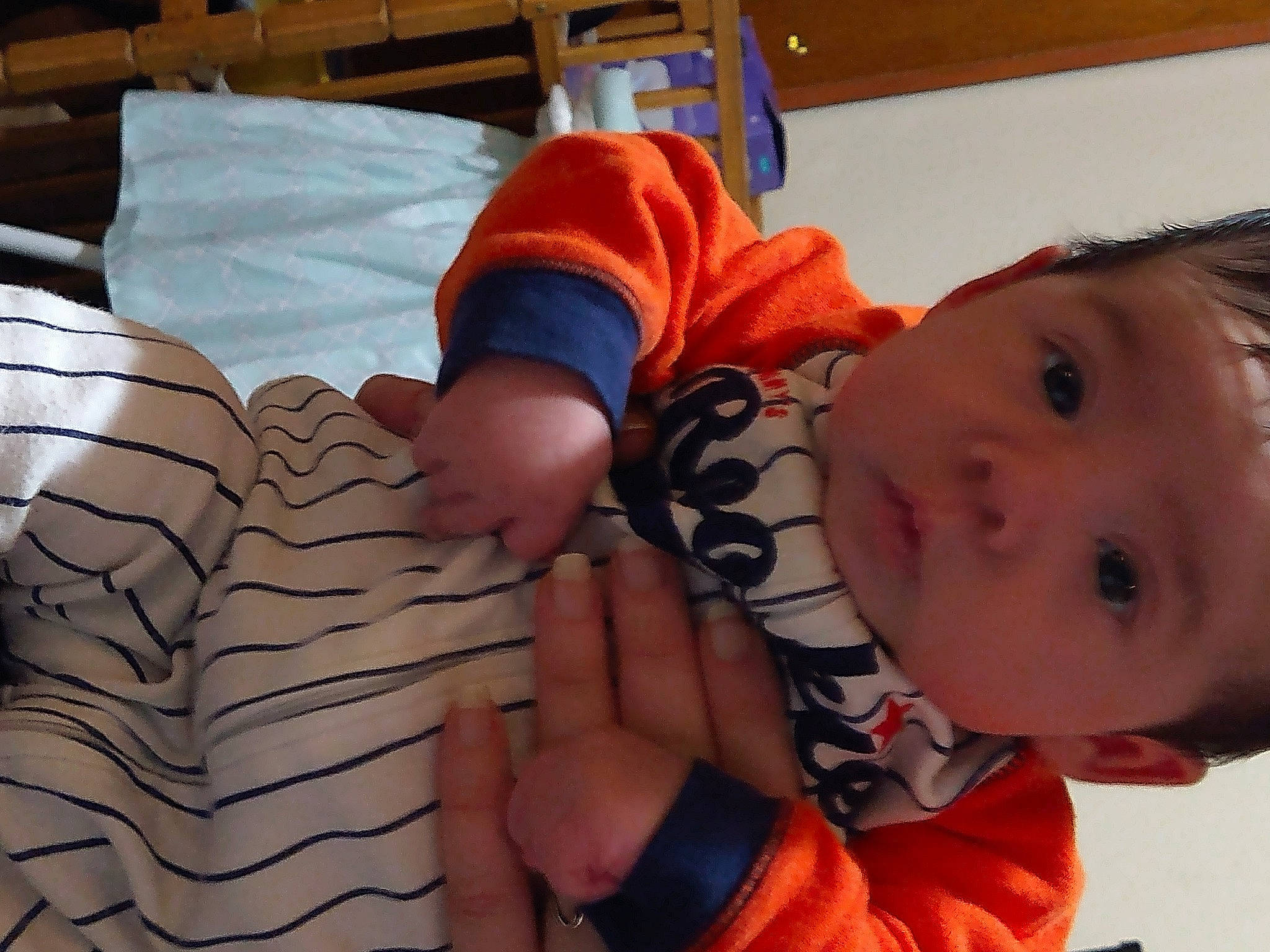 Danillo is registered to the contest to win money with this photo: baby, baby_products, baby_safety, baby_toddler_clothing, bed, cheek, child, comfort, eye, finger, gesture, happy, mouth, nose, pattern, person, pillow, sleeve, textile, thumb