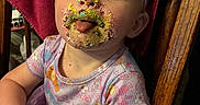 Aurora joined the competition — help win amazing prizes! baby, child, infant, birthday, cake, frosting, sprinkles, messy_face, bow_headband, dress, colorful_clothing, sitting, chair, portrait, indoors, smiling, tongue_out, playful, close_up, family_photo