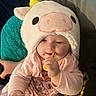 Aurora joined the competition — help win amazing prizes! baby, infant, child, cow_hat, plush_hat, pink_clothing, toy_ring, chewing, sitting, portrait, face, smiling, indoors, blanket, cushion, cozy, close_up, soft_texture, playful, cute