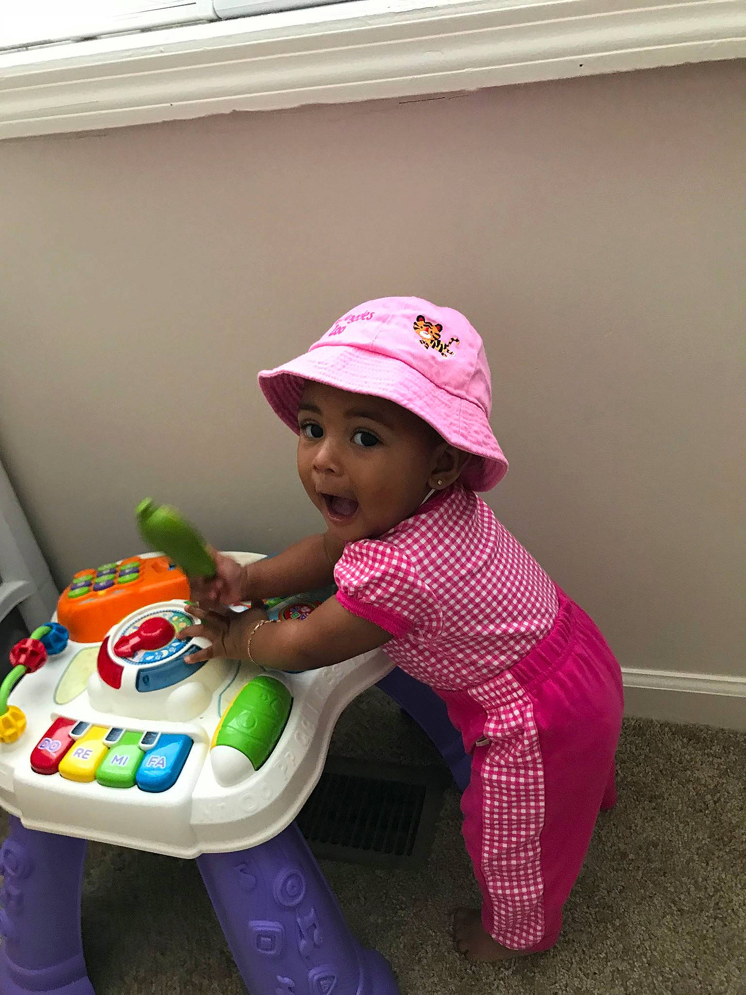 Eryn joined the competition — help win amazing prizes! baby_products, child, fun, headwear, infant, person, pink, play, product, purple, sitting, skin, surprise, toddler, toy