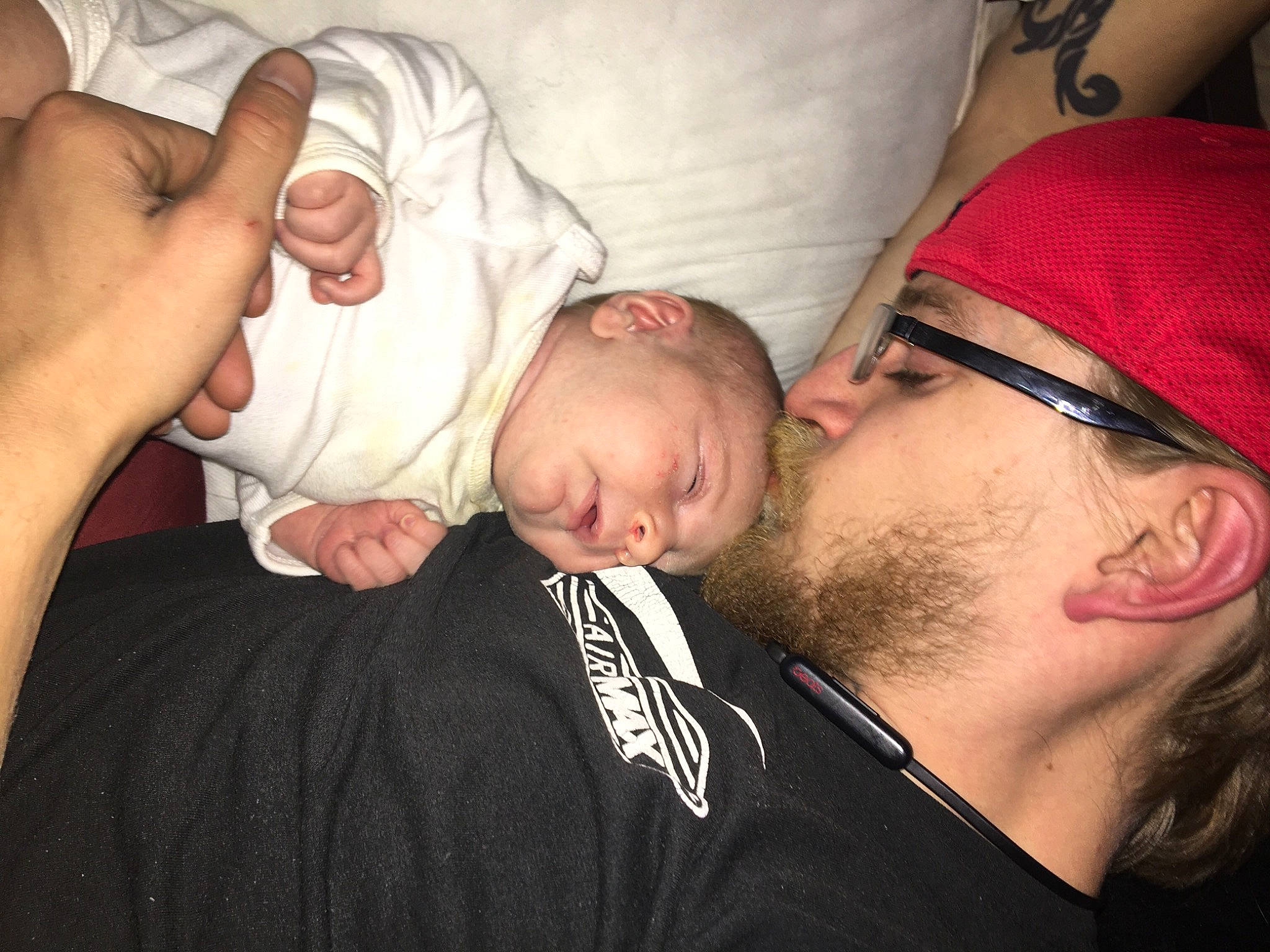 Alaina is registered to the contest to win money with this photo: arm, baby, beard, cheek, comfort, ear, elbow, eyelash, eyewear, finger, gesture, glasses, hand, human_body, mouth, muscle, nose, person, skin, thumb