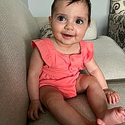 Mira joined the competition — help win amazing prizes! baby, child, smile, sitting, couch, indoor, clothing, infant, happy, person, furniture, cute, skin, face, legs, feet, hand, hair, eyes, room
