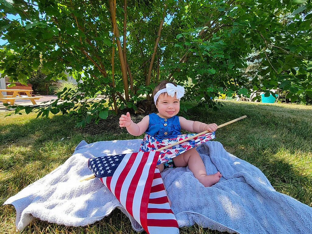 Indy joined the competition — help win amazing prizes! chair, child, electric_blue, event, fun, garden, grass, hat, headwear, joy, lawn, leisure, people_in_nature, person, plant, recreation, shade, sitting, sunlight, tints_and_shades