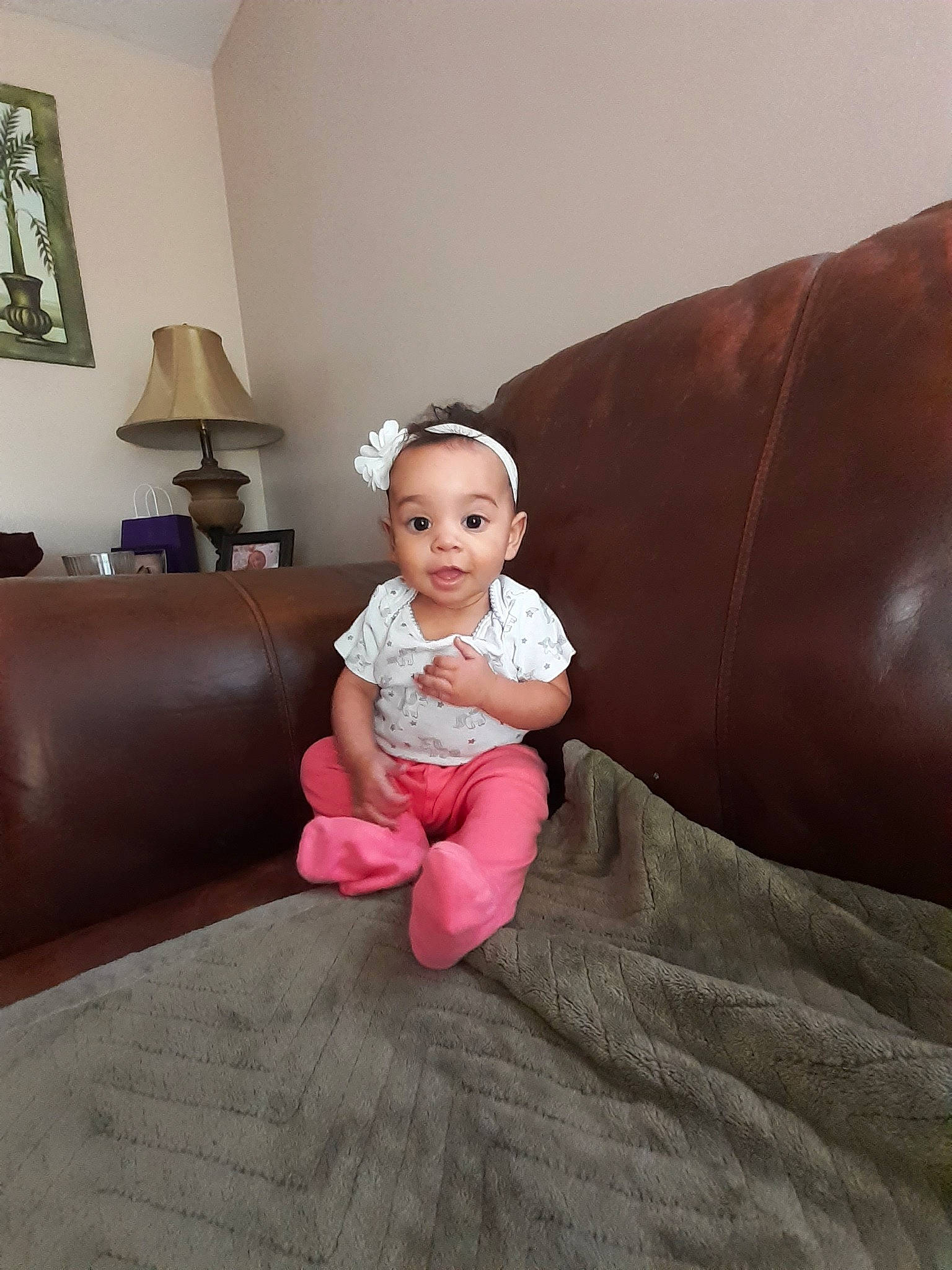 Graycee joined the competition — help win amazing prizes! arm, baby, child, couch, eye, finger, floor, flooring, foot, furniture, joint, leg, person, pink, room, shoulder, sitting, skin, smile, thumb