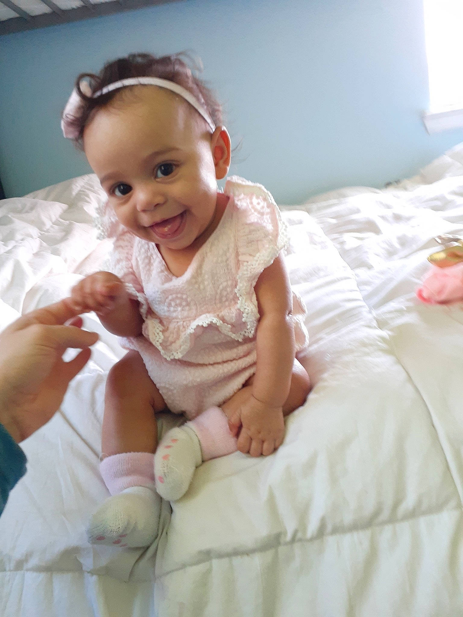 Graycee is registered to the contest to win money with this photo: baby, bedding, cheek, child, comfort, furniture, joy, linens, person, sitting, skin, smile, textile, toddler