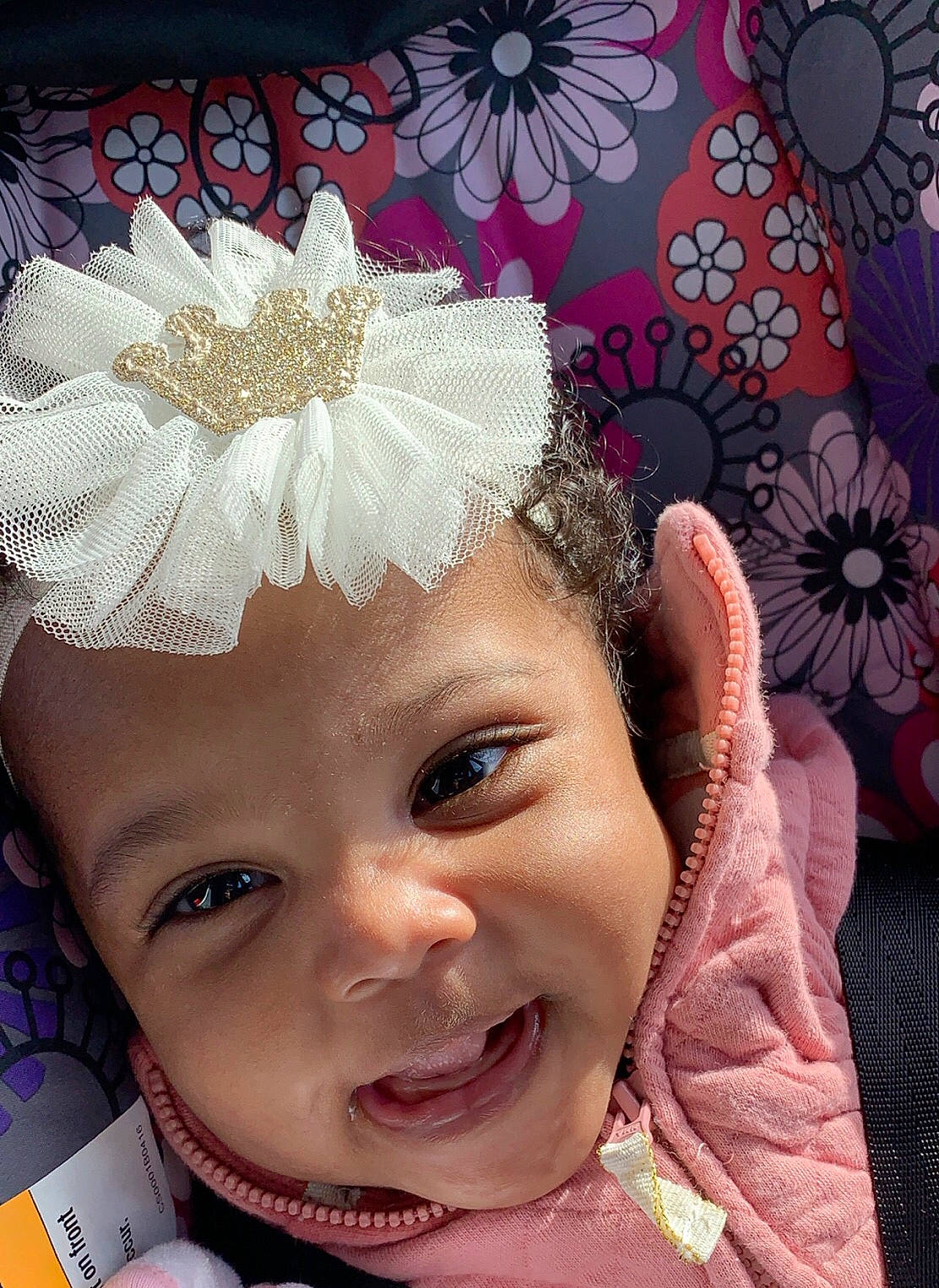 Empress is registered to the contest to win money with this photo: baby, cheek, child, face, fashion_accessory, forehead, hair_accessory, happy, head, headband, headgear, headpiece, nose, person, pink, skin, smile, toddler