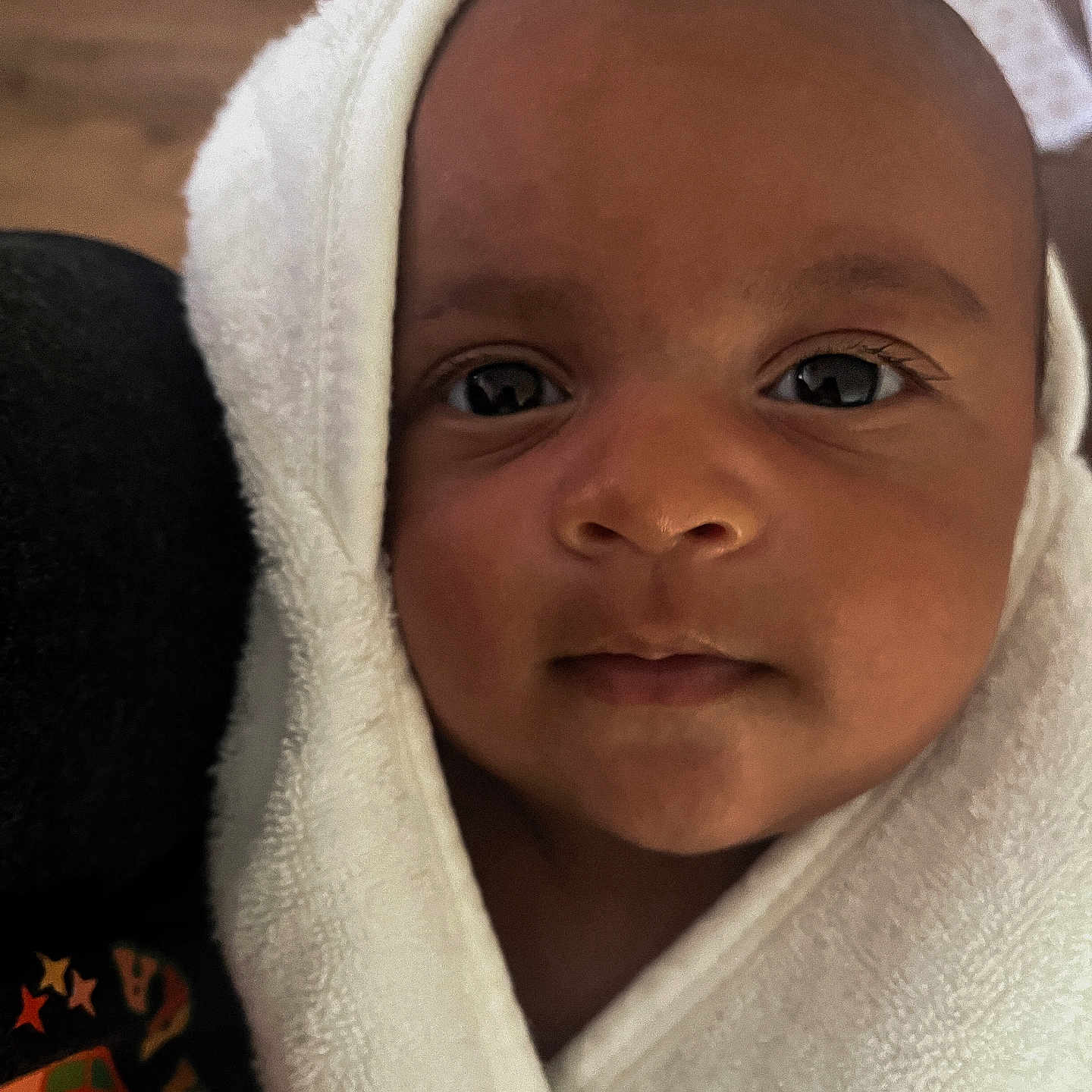 Tatum joined the competition — help win amazing prizes! baby, bathtowel, bonnet, clothing, face, happy, hat, head, hood, hoodie, knitwear, monk, newborn, person, photography, portrait, smile, sweater, sweatshirt, towel