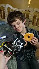 Alex joined the competition — help win amazing prizes! child, comfort_food, cuisine, dish, finger_food, fur, joy, junk_food, person, personal_protective_equipment, play, recreation, sitting, smile, thumb, toddler, toy