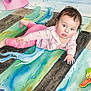 Sariah is registered to the contest to win money with this photo: baby, watercolor, painting, child, blue_eyes, striped_rug, toys, colorful, art, illustration, indoor, playful, pink_clothing, monkey_toy, floor, cute, infant, hand, face, expression
