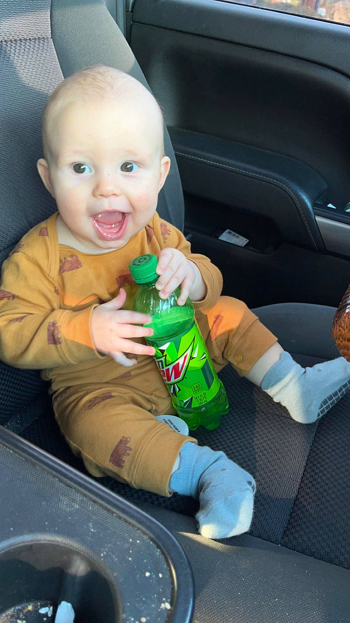 Beckett joined the competition — help win amazing prizes! baby, baby_products, bottle, car_seat, car_seat_cover, cheek, child, finger, fun, hand, human_body, person, plastic_bottle, product, sitting, skin, smile, thumb, toddler, toy