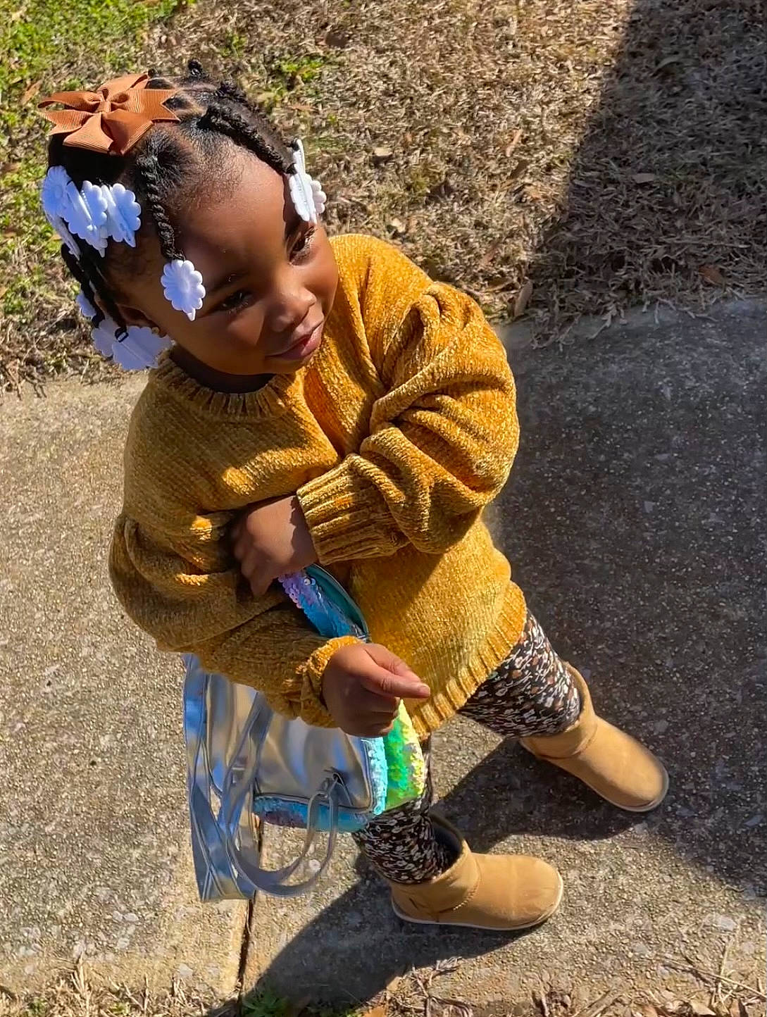 Karli joined the competition — help win amazing prizes! asphalt, child, electric_blue, eyewear, fun, grass, human_leg, knee, landscape, leisure, people_in_nature, person, play, recreation, shadow, sitting, sneakers, soil, sunglasses, toddler