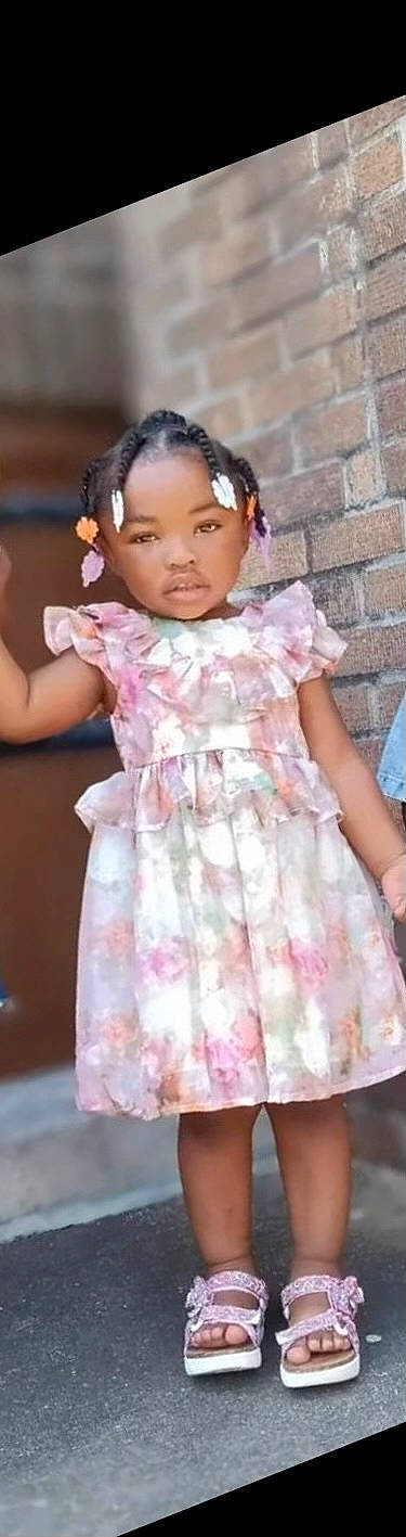 Karli is registered to the contest to win money with this photo: baby_toddler_clothing, child, day_dress, dress, embellishment, eyelash, fashion_accessory, fashion_design, formal_wear, happy, magenta, neck, one_piece_garment, pattern, peach, person, petal, pink, skin, sleeve