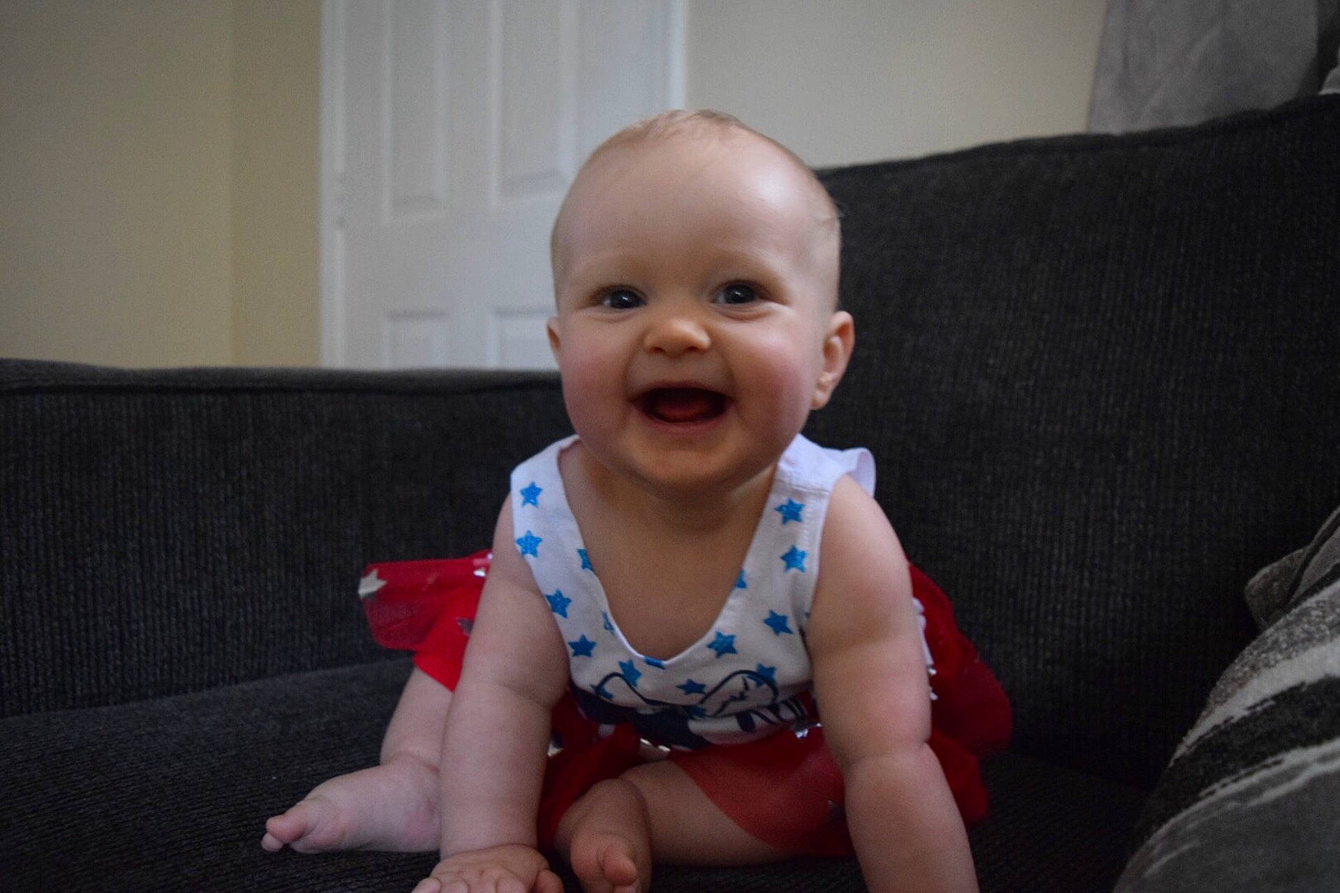 Cali is registered to the contest to win money with this photo: boy, cheek, child, day, ear, eye, facial_expression, finger, fun, girl, hand, infant, mouth, organ, person, product, sitting, skin, smile, toddler