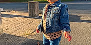 Rose participe au concours pour gagner de l'argent avec cette photo : toddler, child, denim_jacket, boots, leopard_print, sidewalk, shadow, sunlight, outdoor, street, building, tree, casual_clothing, fashion, young_child, person, daylight, jeans, urban, cute