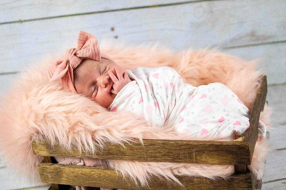 Jazmynn joined the competition — help win amazing prizes! chair, comfort, fashion_accessory, flooring, fur, fur_clothing, grass, happy, leisure, linens, natural_material, peach, person, portrait_photography, sitting, winter, wood