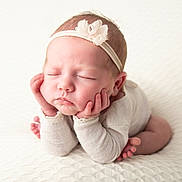 Scarlett joined the competition — help win amazing prizes! newborn, baby, infant, sleeping, headband, flower, white_clothing, soft_texture, blanket, hands, face, peaceful, portrait, cute, resting, skin, small_fingers, child, toddler, indoors