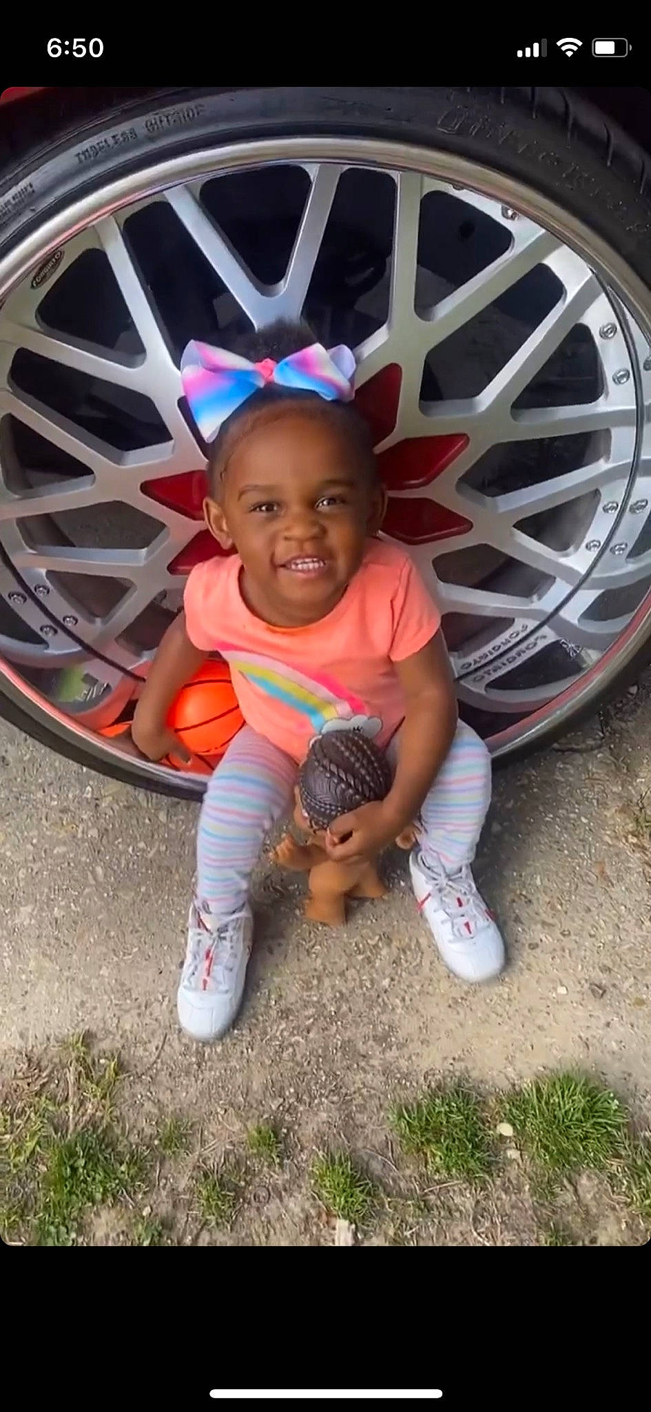 Jacei is registered to the contest to win money with this photo: alloy_wheel, automotive_design, automotive_exterior, automotive_lighting, automotive_tire, bumper, car, grass, happy, hubcap, joy, motor_vehicle, person, rim, shoe, smile, sneakers, t_shirt, tire, toddler