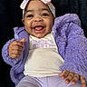 baby, child, smiling, happy, face, headband, clothing, purple, jacket, pants, sitting, portrait, indoor, cute, infant, person, expression, hand, furniture, warm