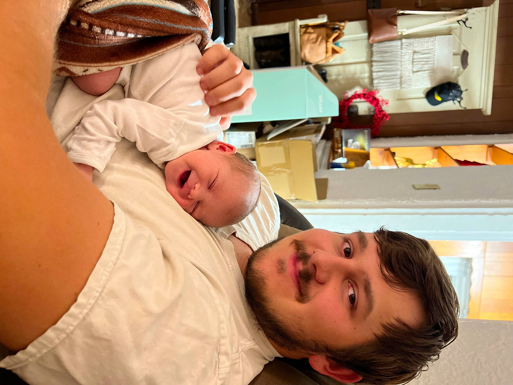 Haven is registered to the contest to win money with this photo: abdomen, baby, cap, child, comfort, event, eyelash, gesture, glasses, happy, hat, health_care, hospital, hospital_bed, joy, mouth, organ, person, room, service