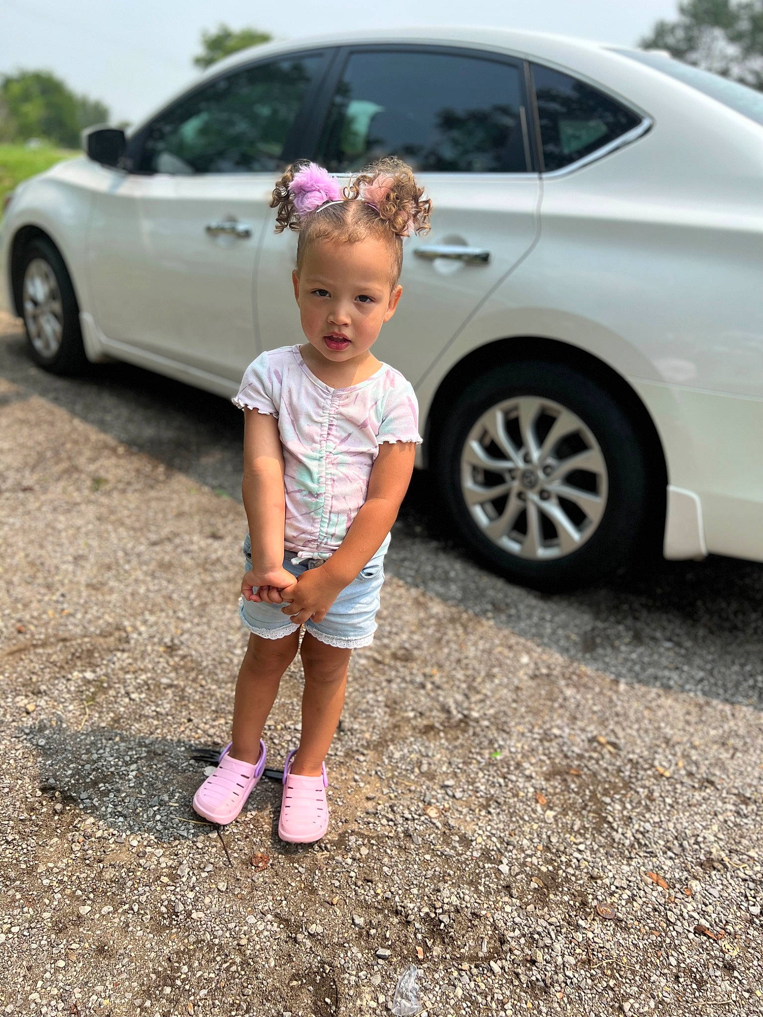 Arianna joined the competition — help win amazing prizes! alloy_wheel, auto_part, automotive_design, automotive_exterior, automotive_lighting, automotive_tire, automotive_wheel_system, car, land_vehicle, motor_vehicle, person, personal_luxury_car, rim, shorts, tints_and_shades, tire, toddler, vehicle, vehicle_door, wheel