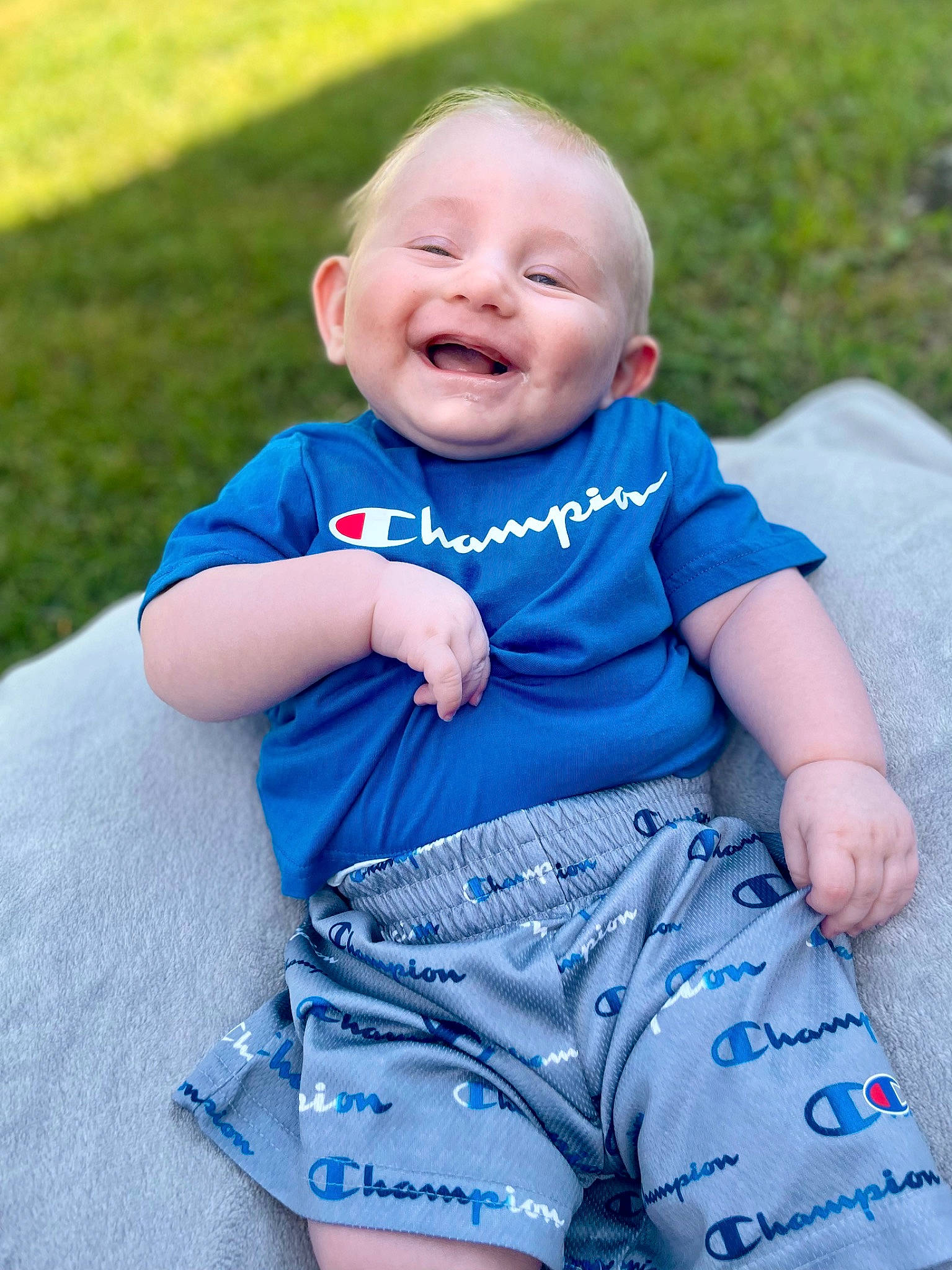 Dominick is registered to the contest to win money with this photo: azure, baby, baby_toddler_clothing, beauty, electric_blue, eye, finger, fun, grass, grass_family, happy, joy, leisure, people, people_in_nature, person, plant, skin, sleeve, smile