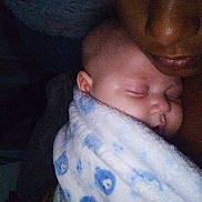 Kairee joined the competition — help win amazing prizes! baby, sleeping, blanket, blue, adult, face, closeup, portrait, nighttime, cozy, snoring, skin, child, person, intimate, resting, cuddle, wrapped, comfort, indoors