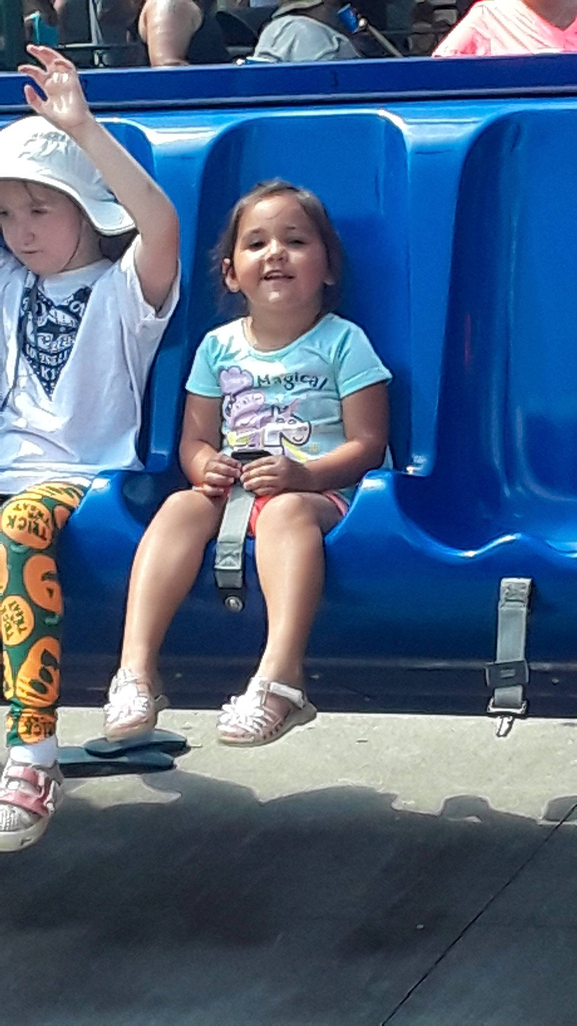 Gabriella is registered to the contest to win money with this photo: blue, child, daughter, fun, headwear, joy, leg, leisure, nose, people, person, play, playground, public_space, recreation, sitting, skin, smile, summer, toddler