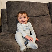 Jahan joined the competition — help win amazing prizes! baby, child, comfort, couch, cozy, cute, expression, face, furniture, happy, home, indoor, infant, pajamas, person, portrait, seated, sitting, smiling, young_child