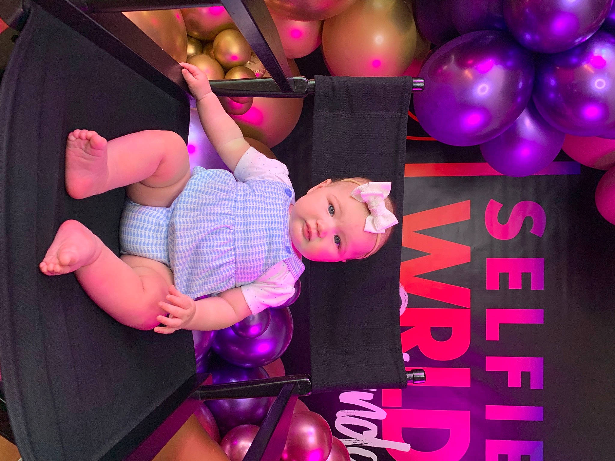 Athena is registered to the contest to win money with this photo: balloon, beauty, entertainment, event, font, fun, happy, headwear, human_leg, leisure, magenta, party, party_supply, performing_arts, person, pink, purple, room, shorts, thigh