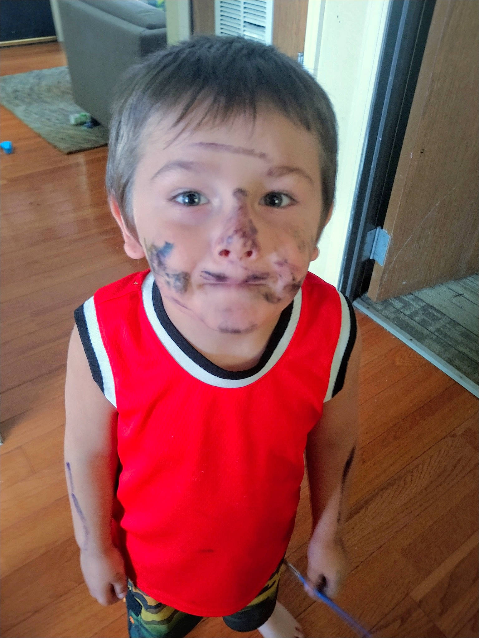 Phoenix is registered to the contest to win money with this photo: active_tank, baby_toddler_clothing, black_hair, cheek, chest, eyebrow, eyelash, flooring, forehead, happy, iris, neck, nose, person, shorts, skin, sleeveless_shirt, t_shirt, toddler, vest