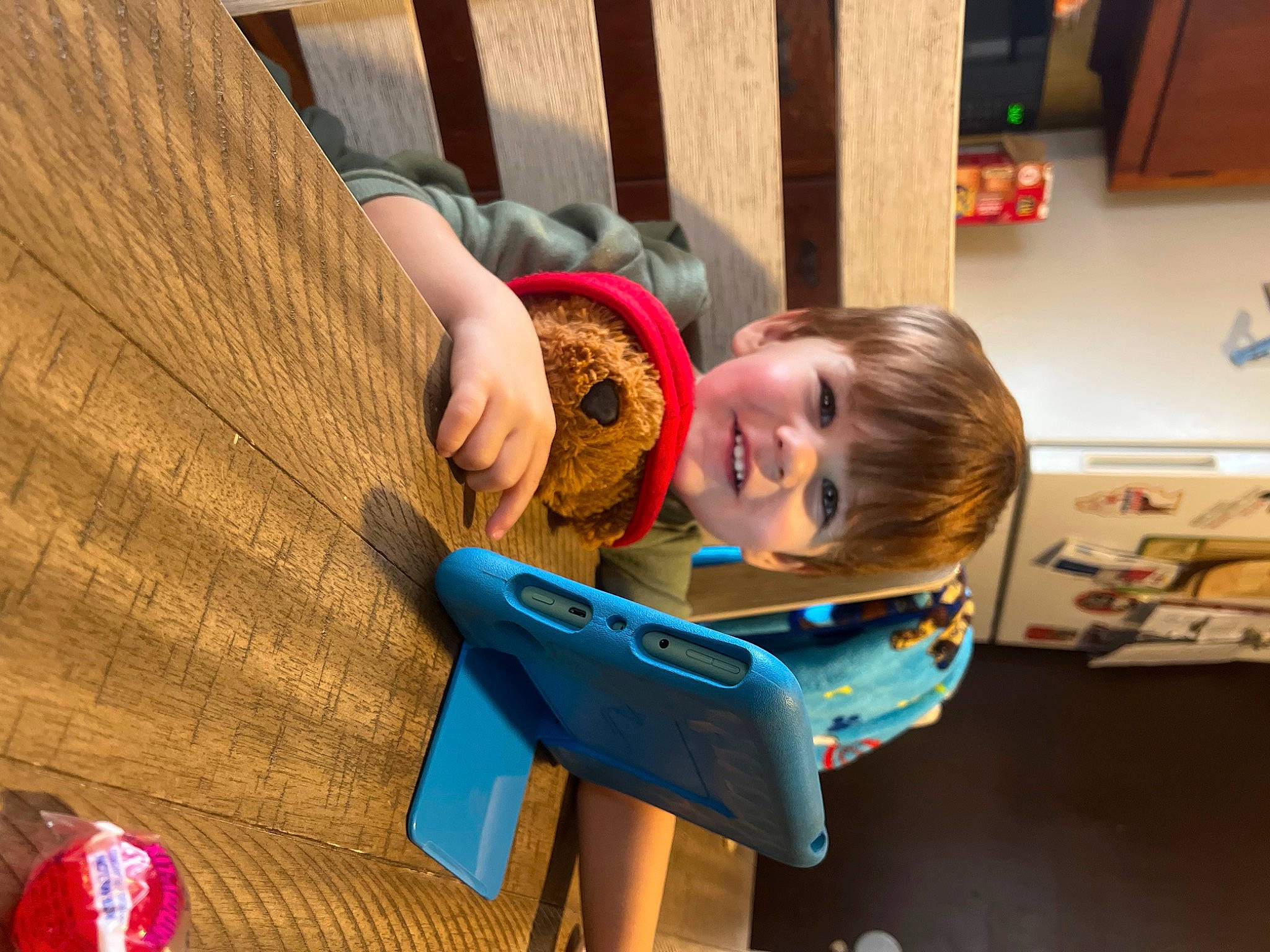 Steven is registered to the contest to win money with this photo: baby_toddler_clothing, child, comfort, electric_blue, flooring, fun, happy, hardwood, head, house, joy, leisure, person, red, room, sitting, smile, toddler, tree, varnish