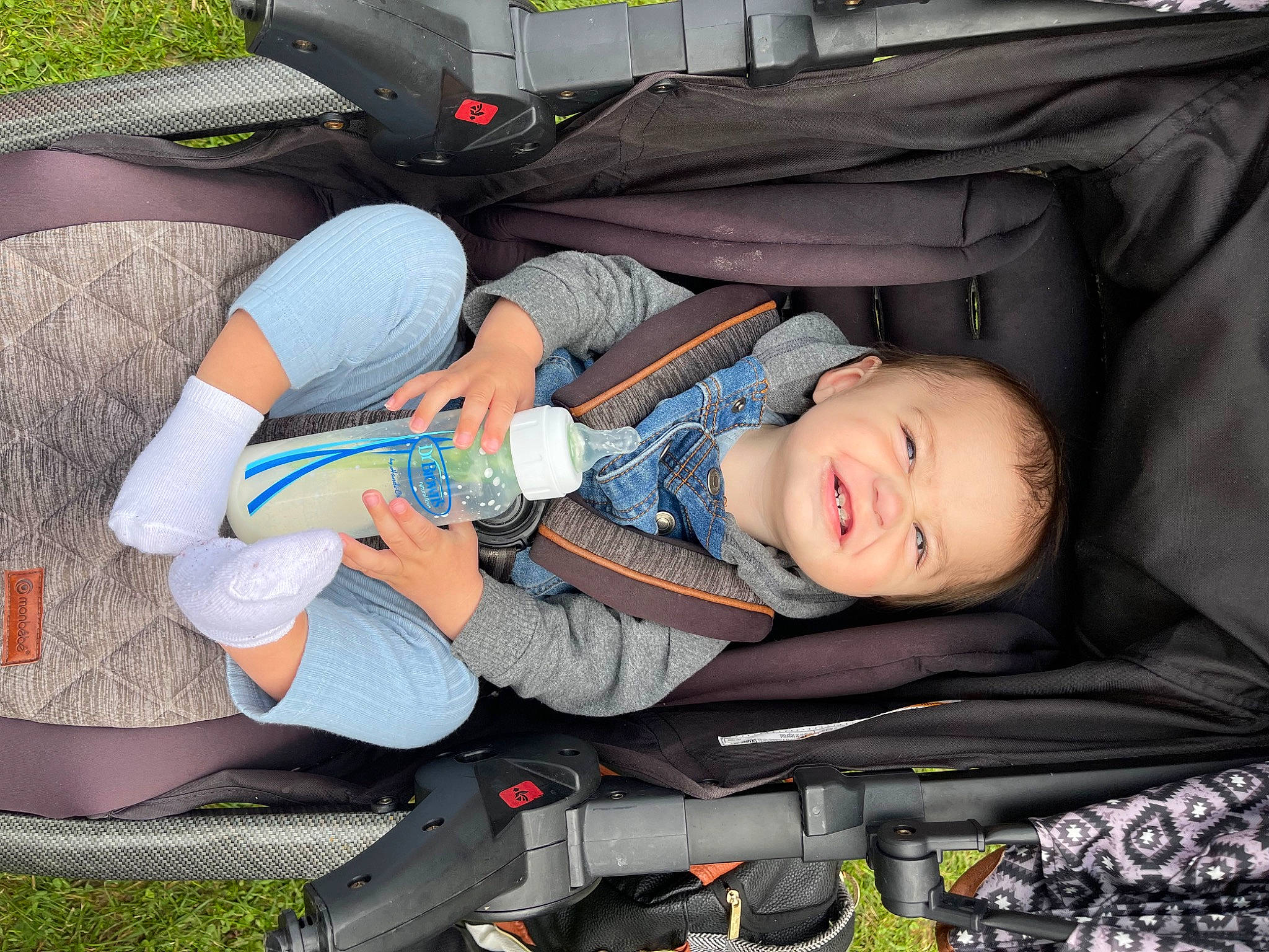 Ryan Jr is registered to the contest to win money with this photo: auto_part, baby, baby_carriage, baby_products, bag, car_seat, child, comfort, family_car, grass, lap, motor_vehicle, person, sitting, smile, toddler, vehicle_door