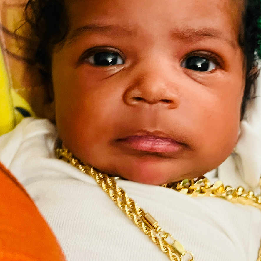 Selahsynai joined the competition — help win amazing prizes! baby, child, close_up, colorful_background, curly_hair, cute, expression, face, gold_chain, headshot, indoors, infant, jewelry, looking_at_camera, person, portrait, skin, soft_lighting, white_clothing, young
